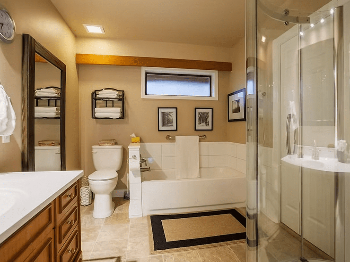 Elegant bathroom featuring framed wall art