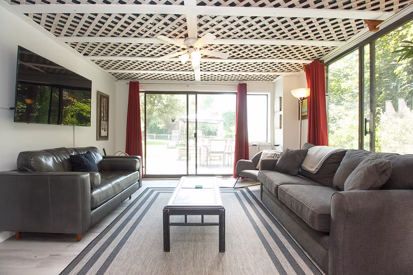 Contemporary lounge with red curtains
