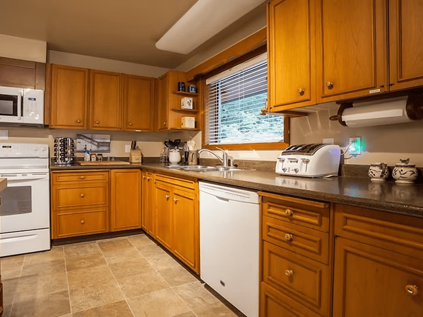 Wooden kitchen cabinets with modern appliances