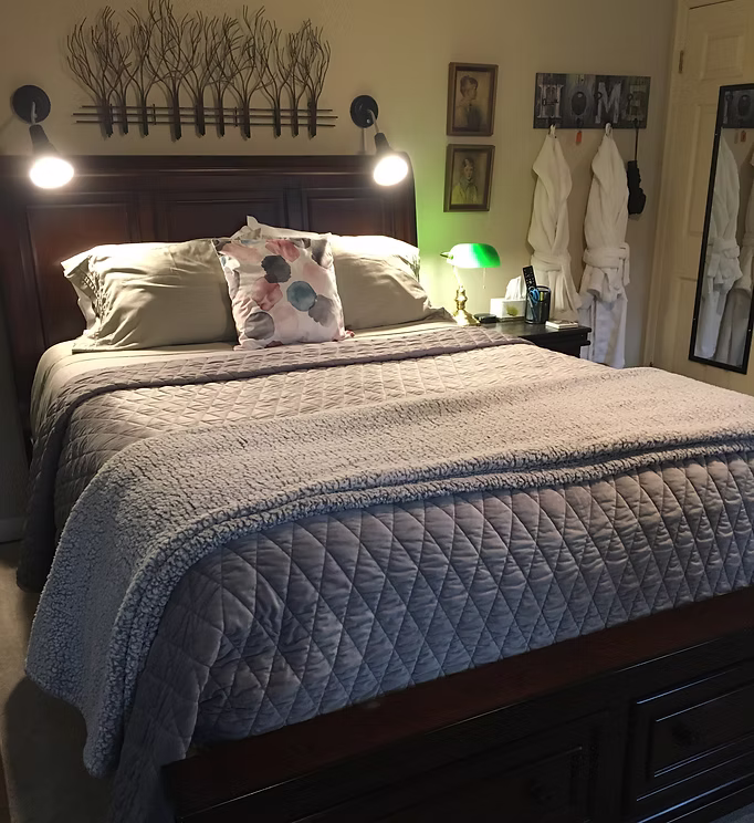 Elegant bed with soft gray bedding
