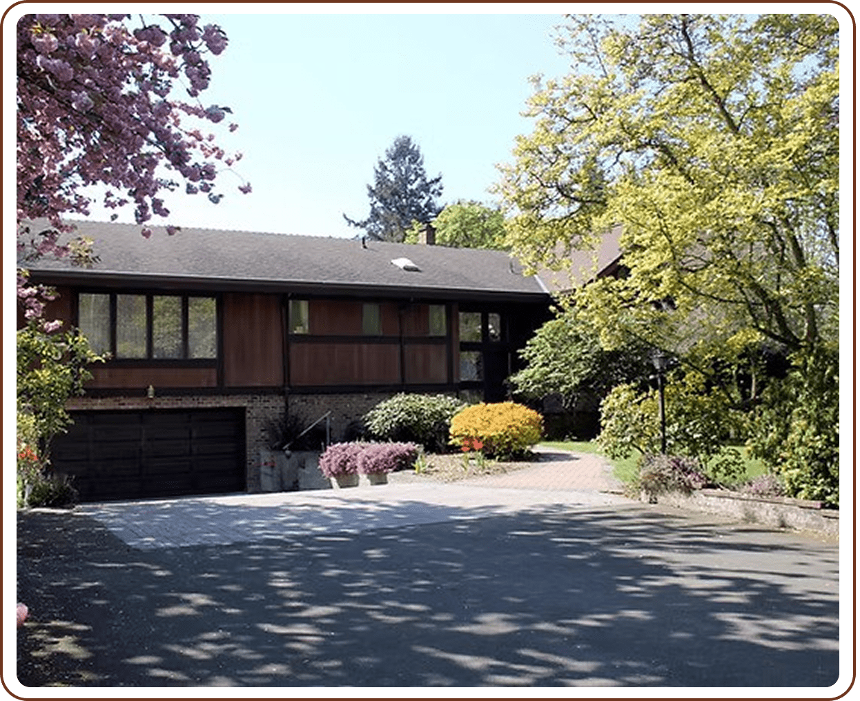 House with blooming garden and driveway