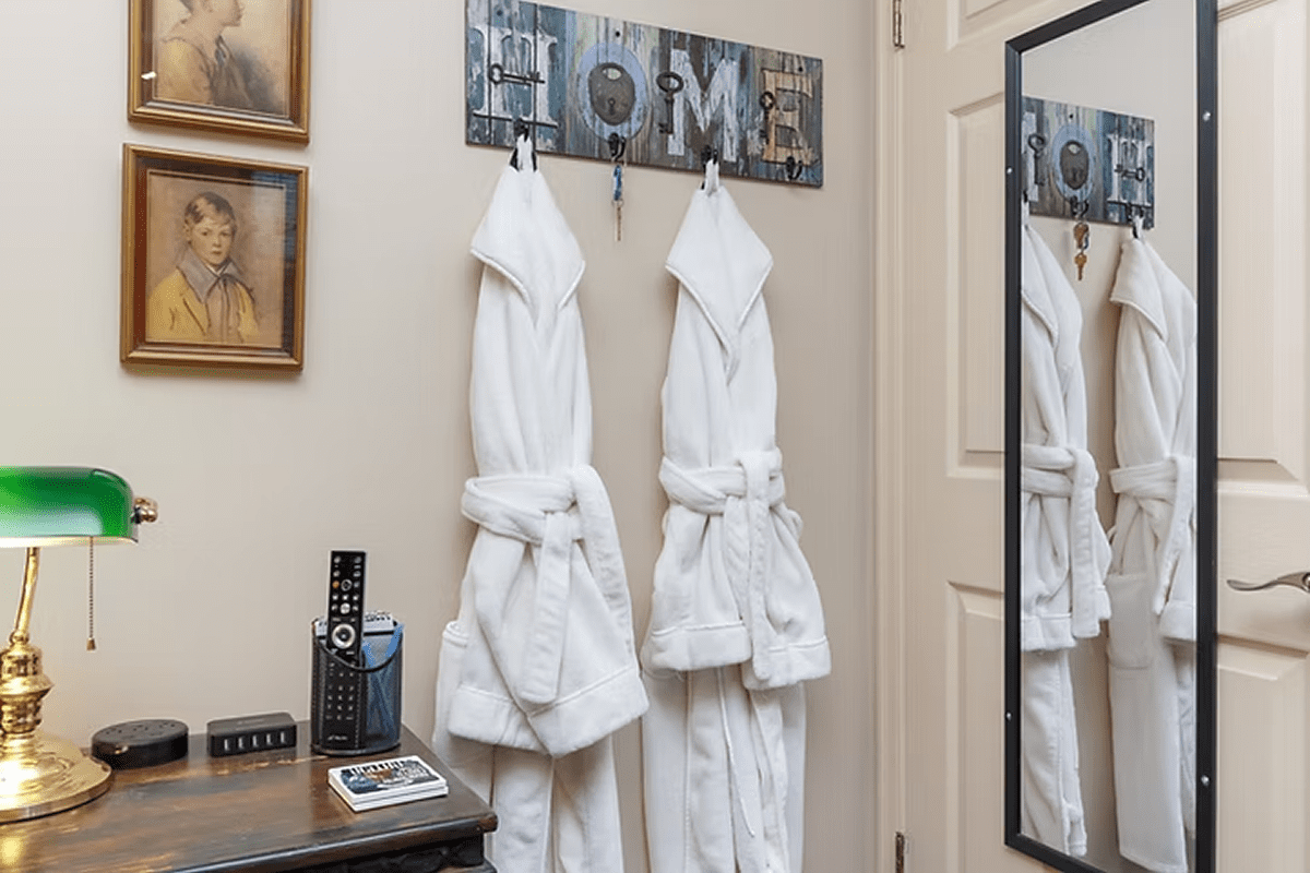 White robes hanging in cozy hallway