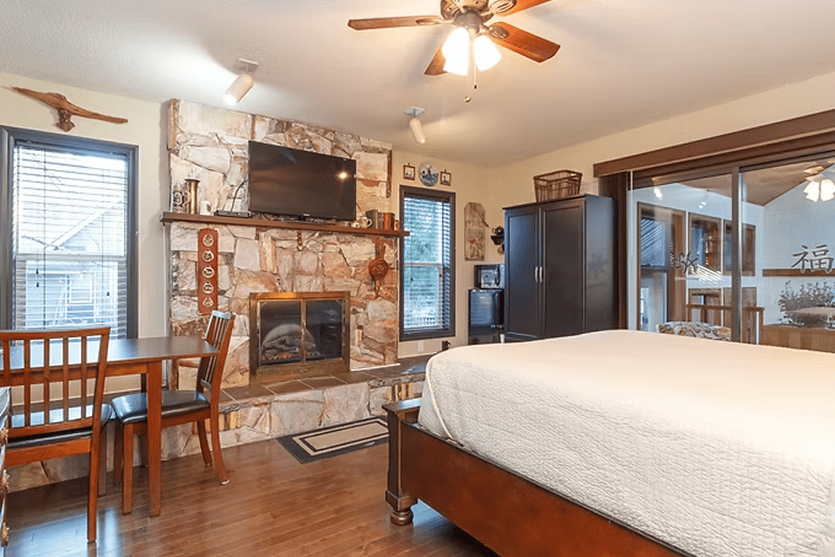 Rustic bedroom with a wooden table set.