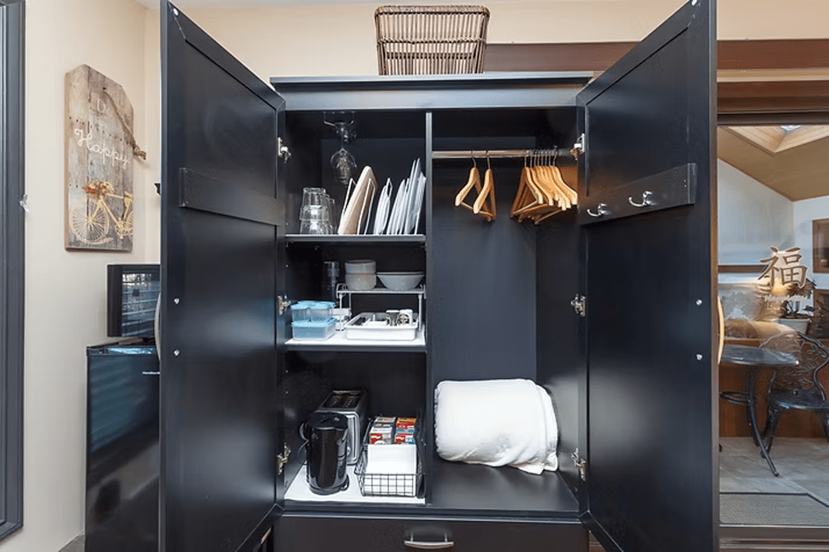 Modern cabinet with dishes and hangers