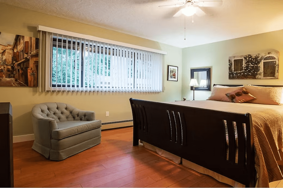 Bedroom with large window and decor